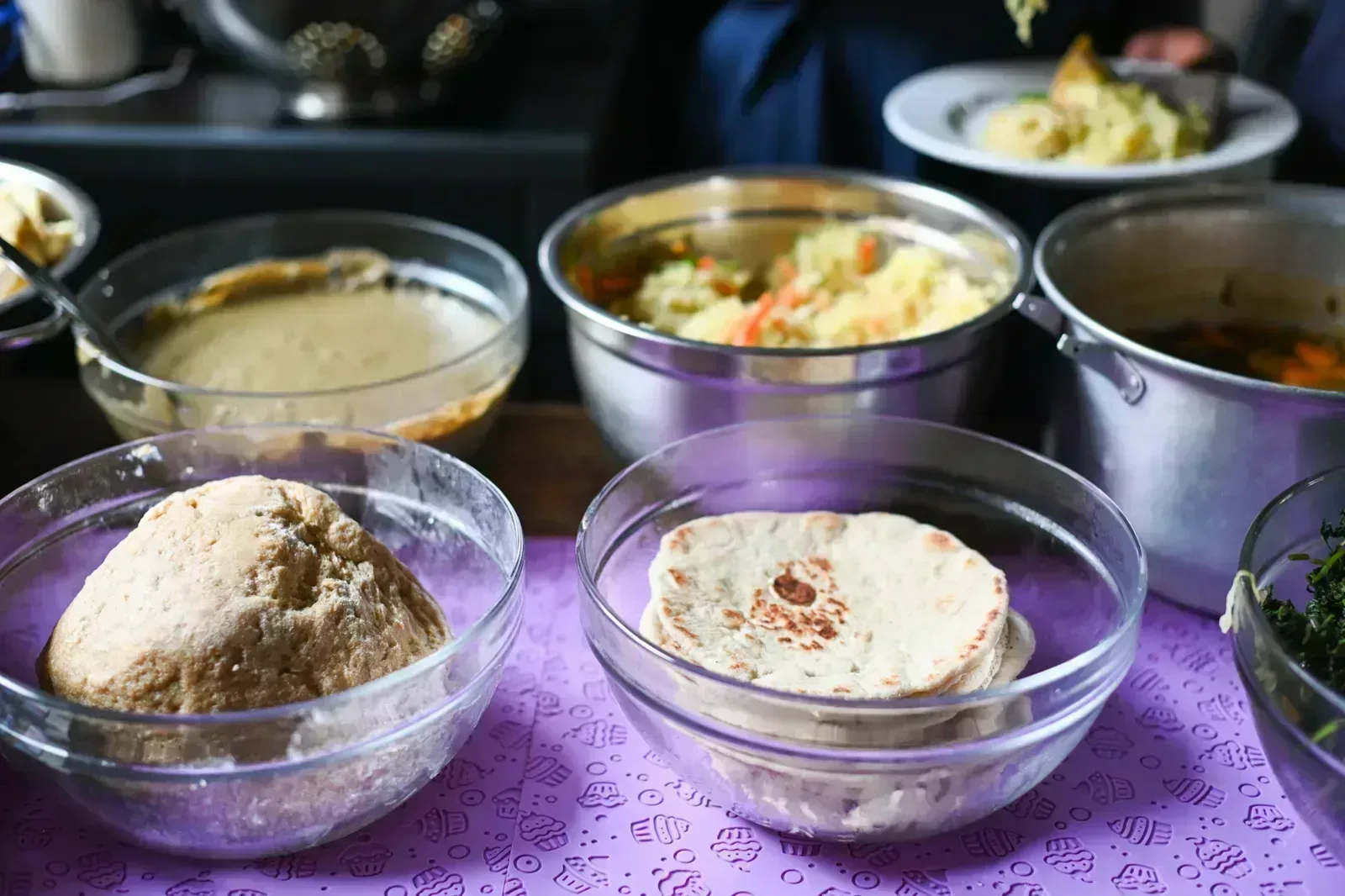 Dough, flatbreads and vegetable dishes prepared during the cooking session