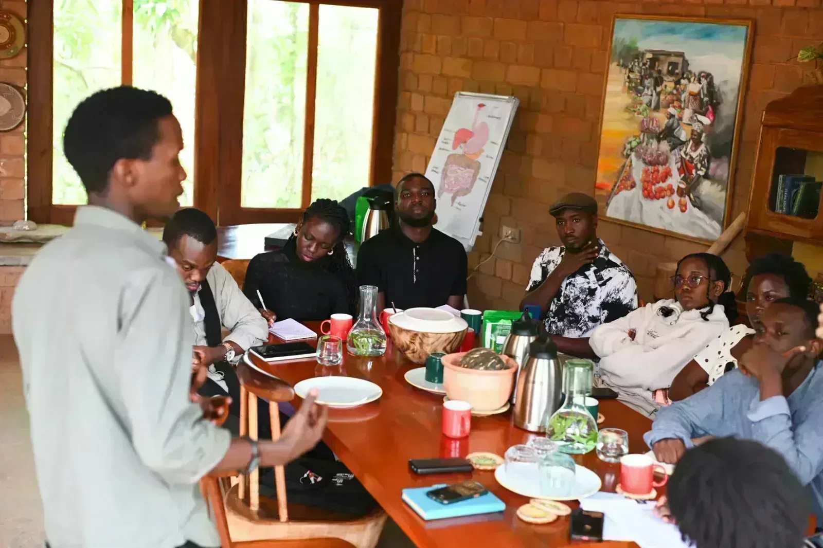 Learn N' Lunch team members meeting with Body and Soil Africa staff during a partnership visit in Mityana, Uganda