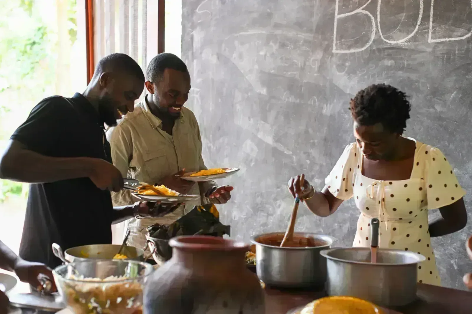 learn and lunch team serving themselves a food at body & soil